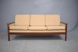 Comfortable Danish made 3 seat sofa with dark wood show frame. 