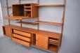 You are free to arrange the cabinets and shelves as you feel once the rails are wall mounted