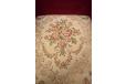 Vintage sprung cushion armchair with floral pattern on seat and red velour