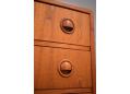 Cup handled chest of 6 teak drawers with bow front. 