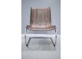 Lounger chair design by Peter Karpf in brown makassar laminate.