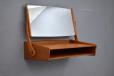practical vanity unit with pivot mirror aboe open storage compartment