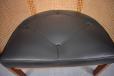 Vintage black leather seat with thin piping and buttons. Beautiful vintage leather 