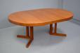 Johannes Andersen round top dining table with 2 extra leaves produced by Hans Bech