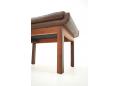 Rosewood frame footstool with feather-filled brown leather cushion.