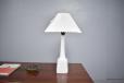 White ceramic base table lamp with pleated shade