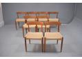Elegant teak dining chairs with laminated curved back rests