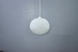 1960s design pendant light with oval shaped shade in opaline glass.