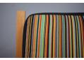 DAW Rainbow fabric upholstered armchair with light oak frame.