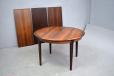 Midcentury rosewood dining table extending with 3 extra leaves