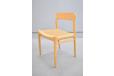 Set of light oak dining chairs with woven papercord seats by Niels Moller