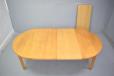 Light oak dining table with 3 leaves produced by Omann Junior Mobelfabrik