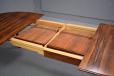 Oval top vintage rosewood dining table with 2 self stored leaves