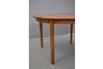 Vintage rosewood round dining table extendable with 2 leaves. 