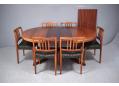 Midcentury design oval top dining table in rosewood with 2 leaves.