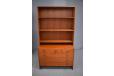 Teak storage unit with bookcase top & chest of drawers base.