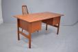 Elegant teak desk with lots of space around it and open to light flow