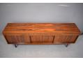 Archie shine produced sideboard in rosewood with 3 doors.