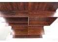 2 bay wall mounted system in rosewood designed by Poul Cadovius.