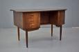 The desk features a bank of 3 drawers, the top of which locks for extra security