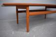 1960s vintage teak coffee table with suspended magazine shelf and raised sides