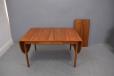 Extending dining table model 23 ablee to seat from 2 to 10 with addition of leaves