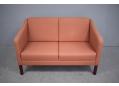 Box frame 2 seat sofa with original fabric and wooden legs.