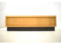 Elegant light oak floating design with black plinth