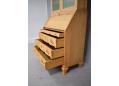 Below the writing desk are 3 large drawers of equal depth.