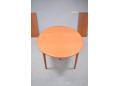 Teak model 212 oval dining table with tripod legs.