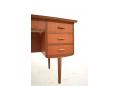 The right bay contains 3 drawers each with curved finger grips.