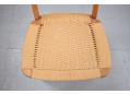 Papercord seat on beech framed child's chair with teak back rest.