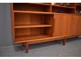 Sliding door sideboard with bookcase top made in Denmark.