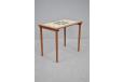 Slender leg side table in teak with heat and liquid proof tiled top