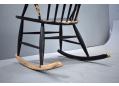 Large wide curved seat is made of laminated wood with black lacquer.