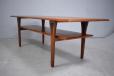 Large rectangular top coffee table made in Denmark with magazine shelf