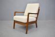 1960s production beech frame armchair with cream cushions
