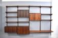 Modular Rosewood shelving system spanning 4 bays for sale
