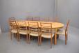 Solid oak dining table with oval top and carved legs