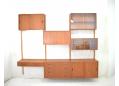 Vintage Danish design wall-mounted storage system in teak. SOLD