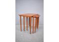 Danish nesting tables in teak with tapering round legs.