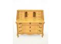 The bureau contains 6 drawers & a small door in the space behind the desk.