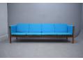 Long and comfortable 4 seat sofa with visible rosewood frame. Ap stolen 1965