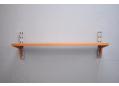 CADO system shelf in teak with pair dowel-mounted supports.