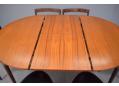 Extended table now comfortable to seat 6. Extends with fold-out leaf hidden in table 