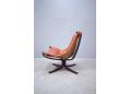Norwegian easy chair with low back and tan leather upholstery