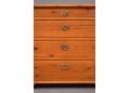Original escutcheons on each drawer face.