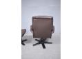 Swivel chair in brown colour leather with matching foot stool.