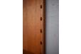The unique dowl locking system which secures shelves and cabinets to the panel