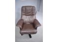 Brown leather upholstered swivel chair designed by Hjort Knudsen.